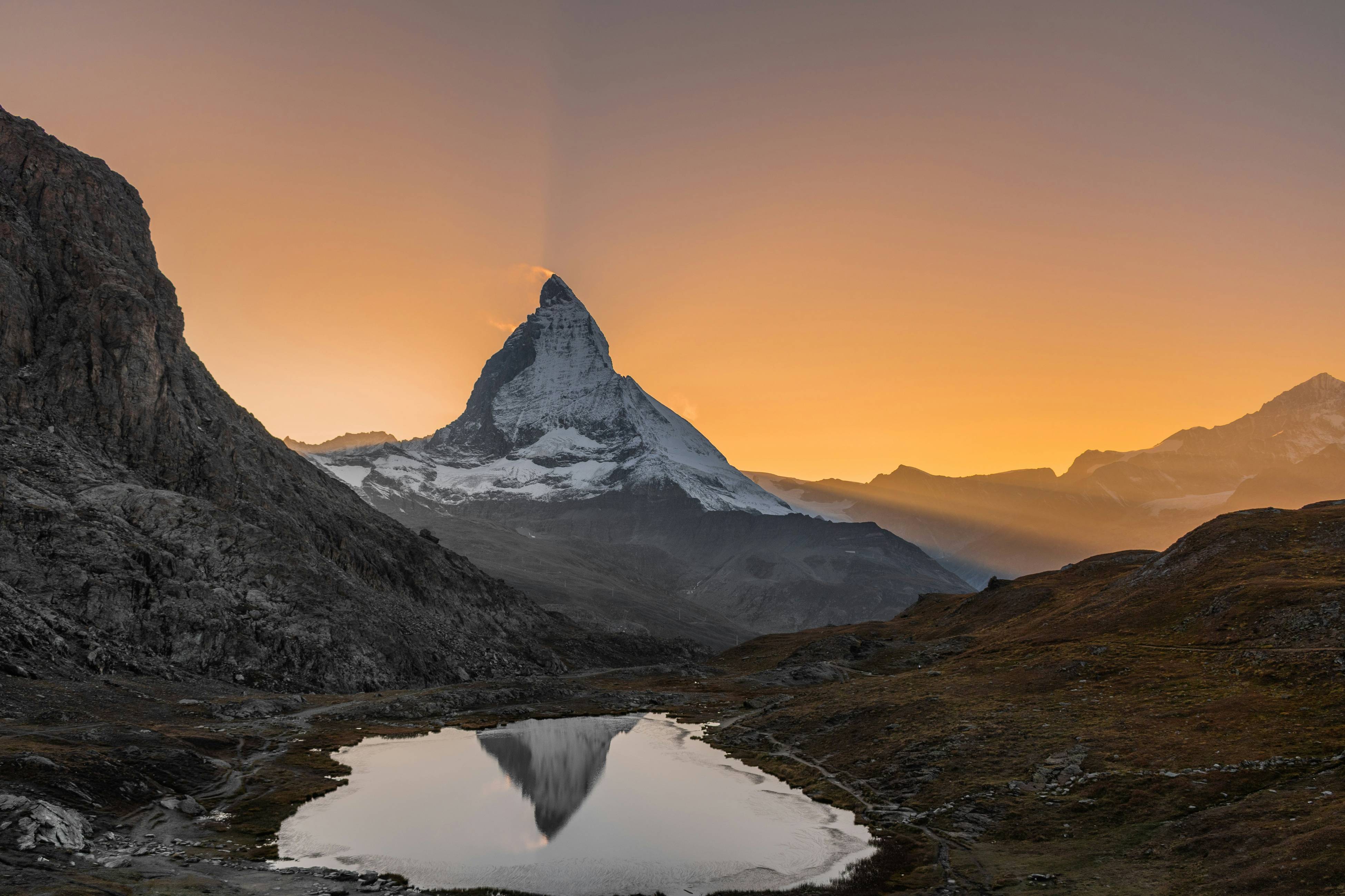 a mountain with a lake in front of it