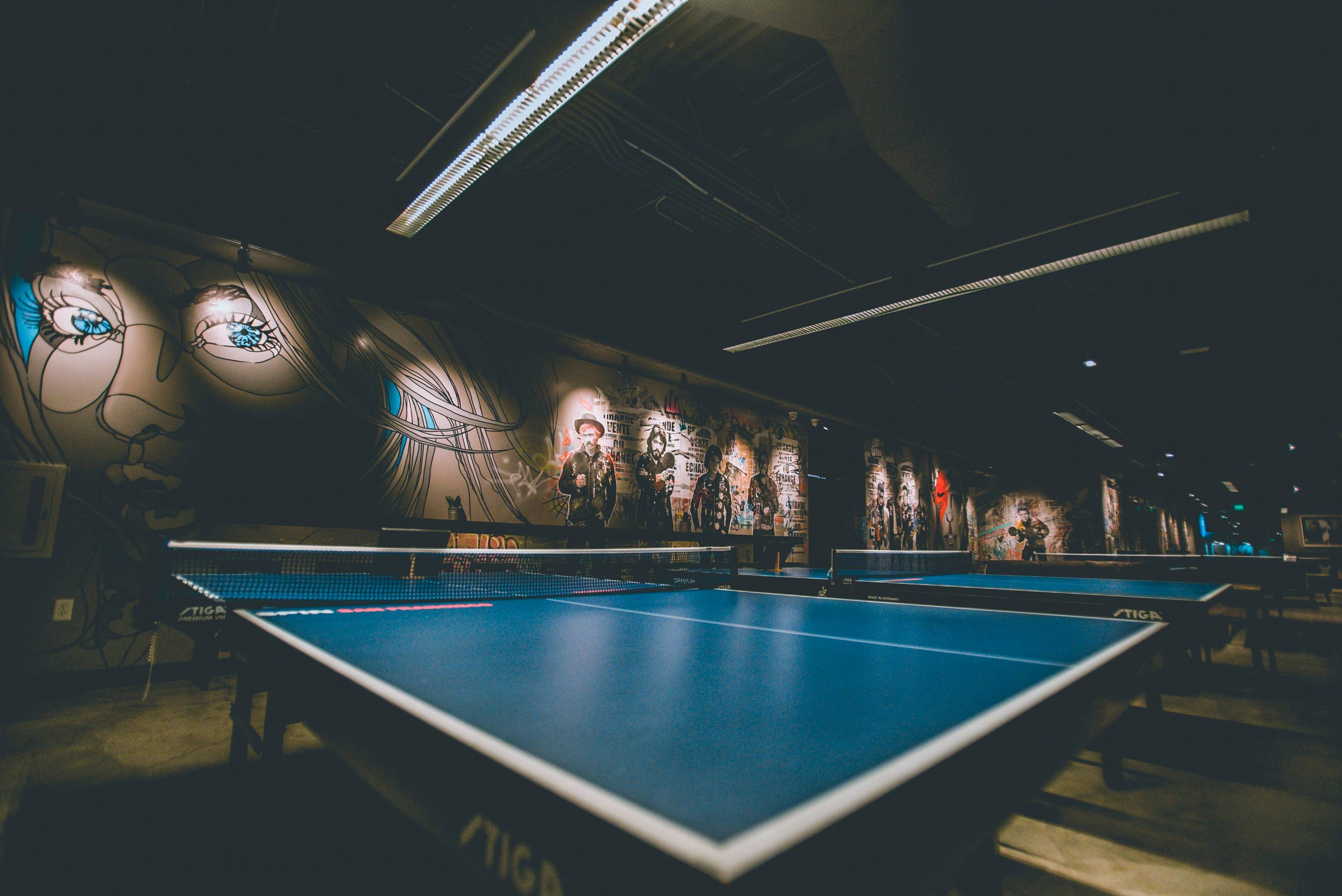 selective focus of blue ping-pong table
