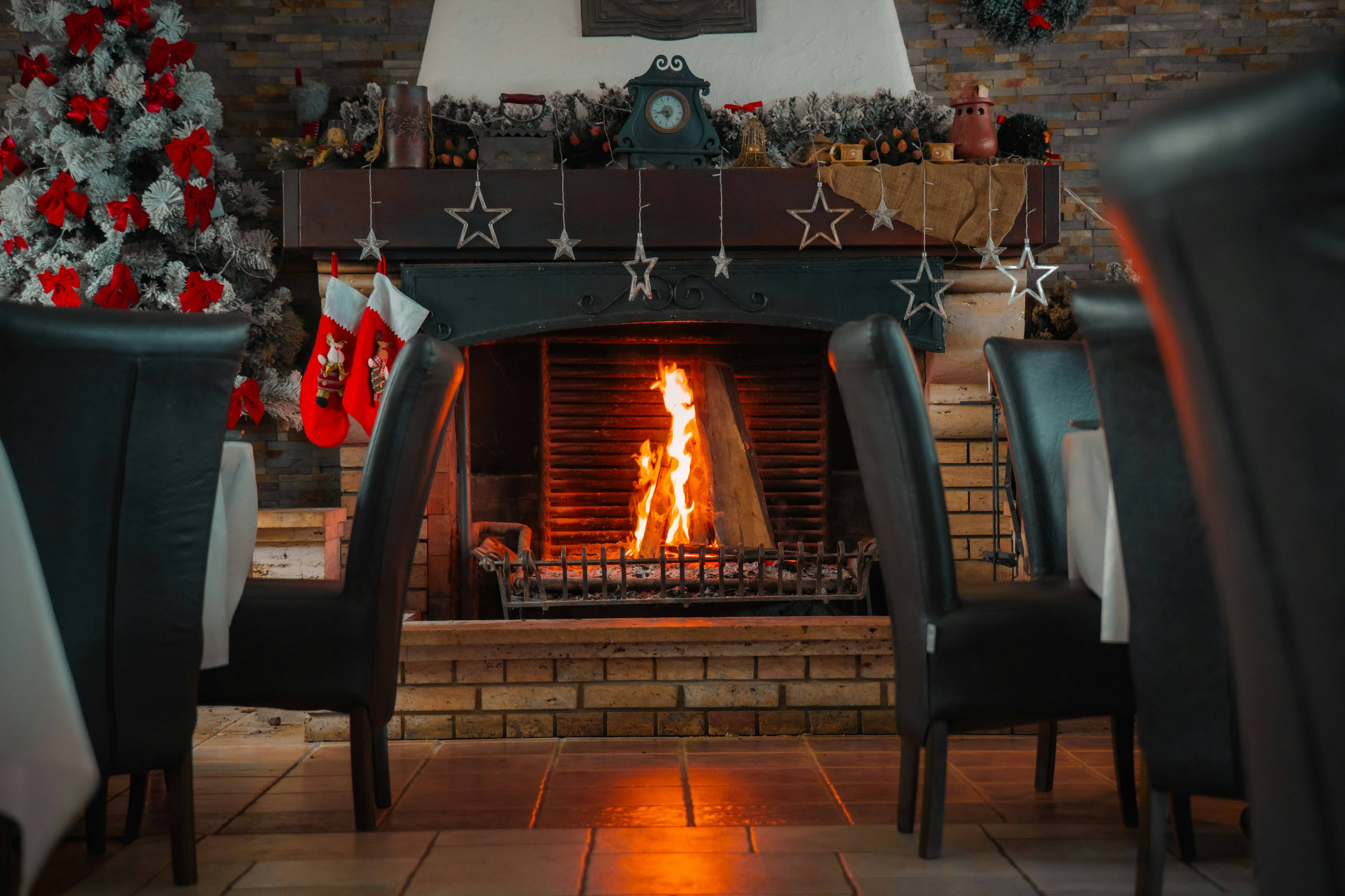 A fireplace in a living room filled with furniture