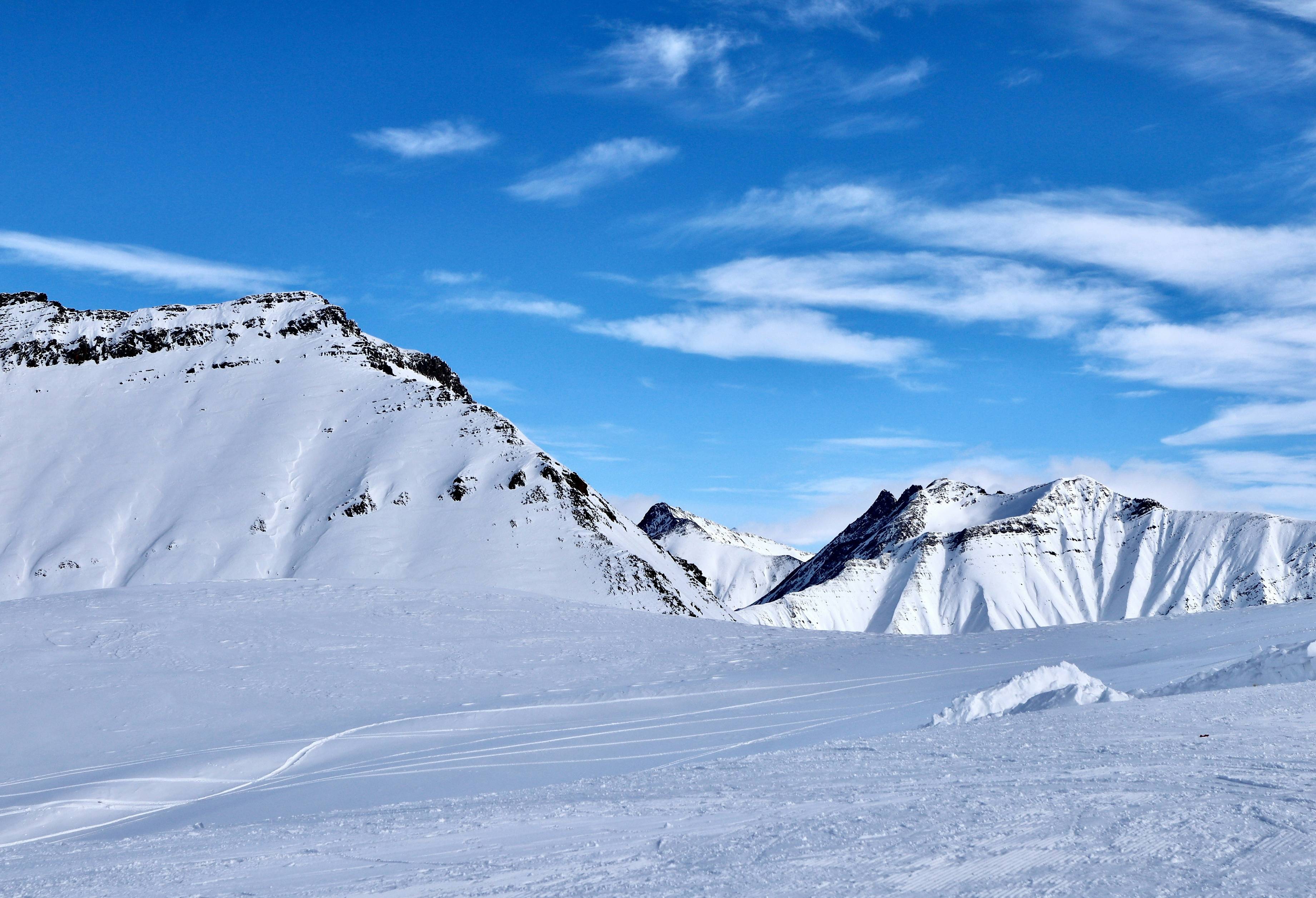 a person skiing down a snow covered mountain