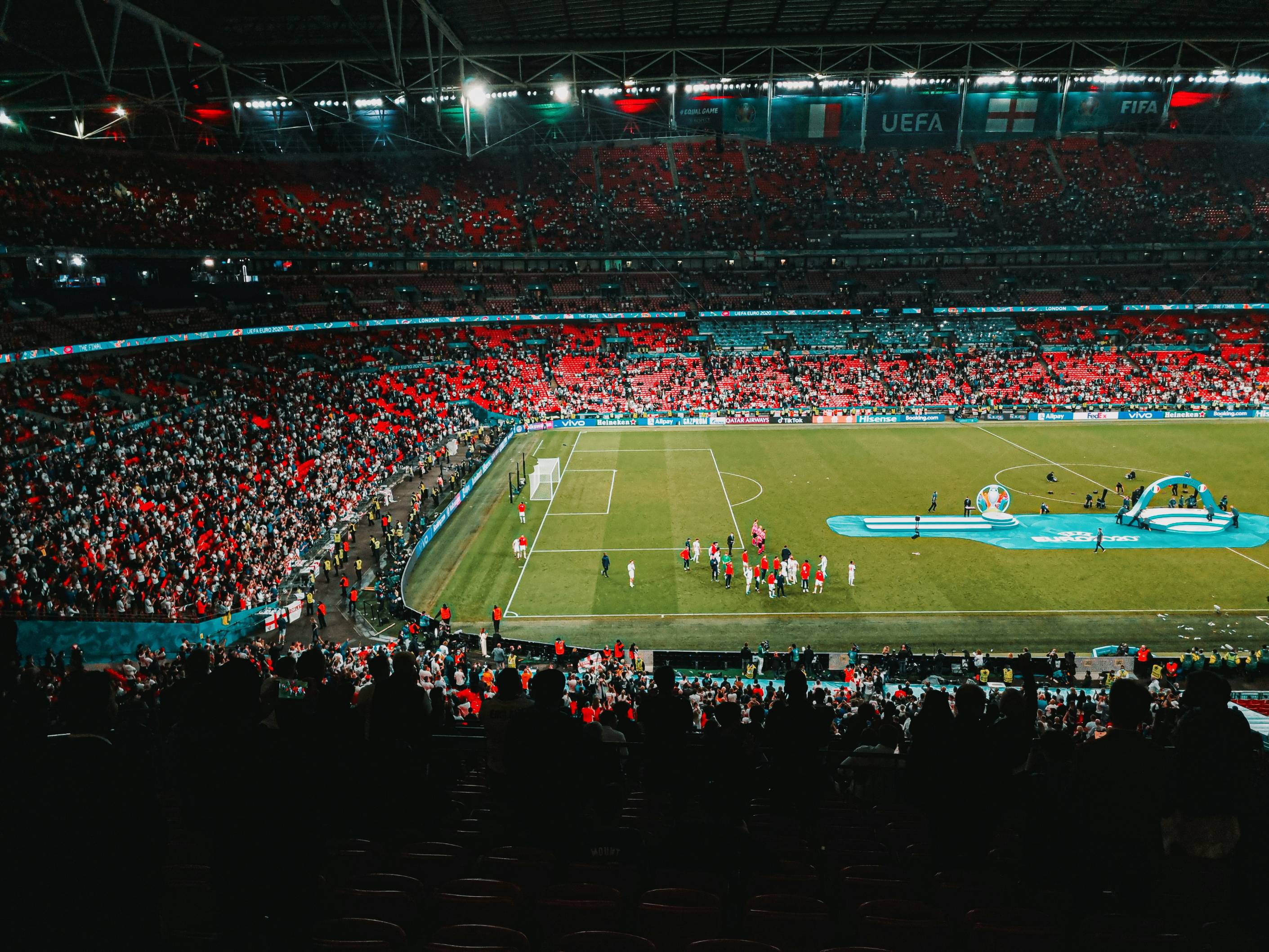 people watching football game on stadium