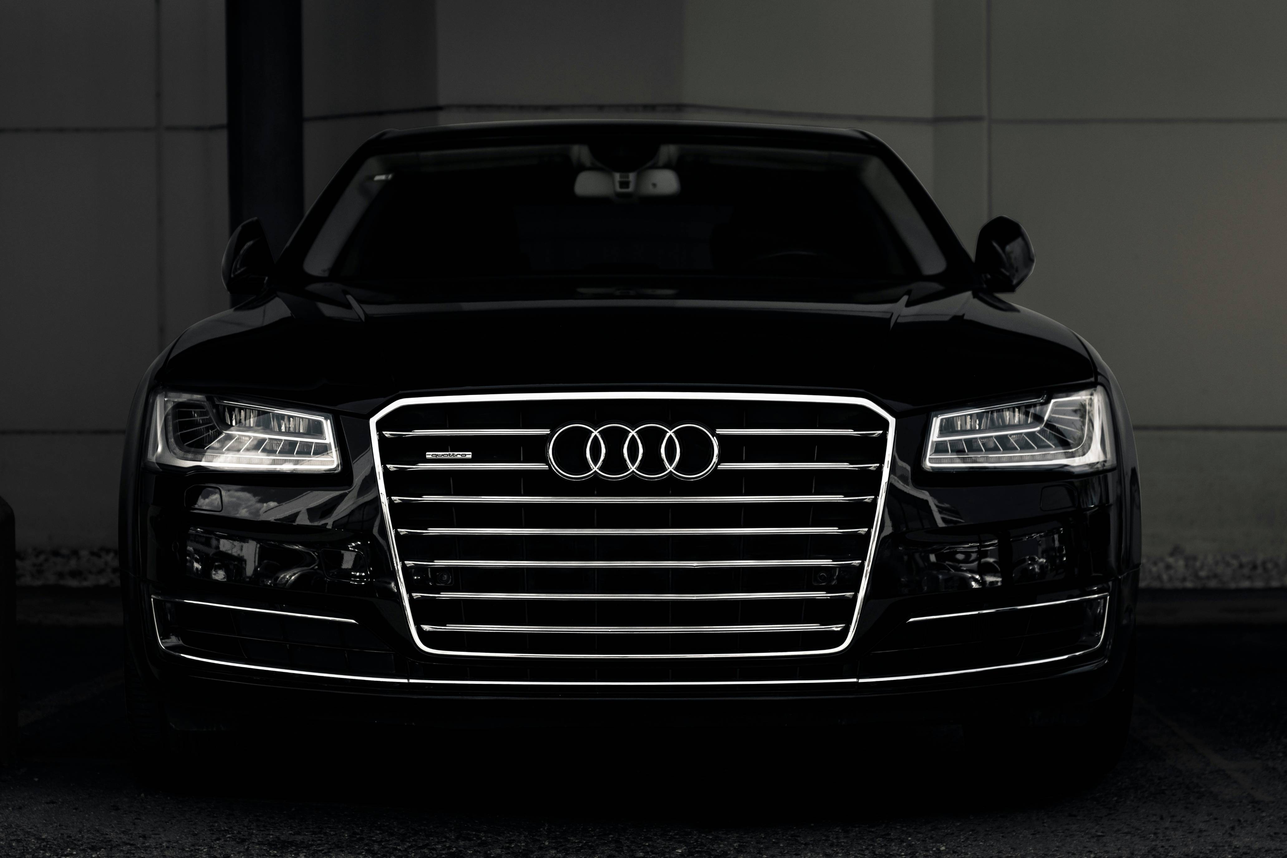 a black and white photo of an audi car