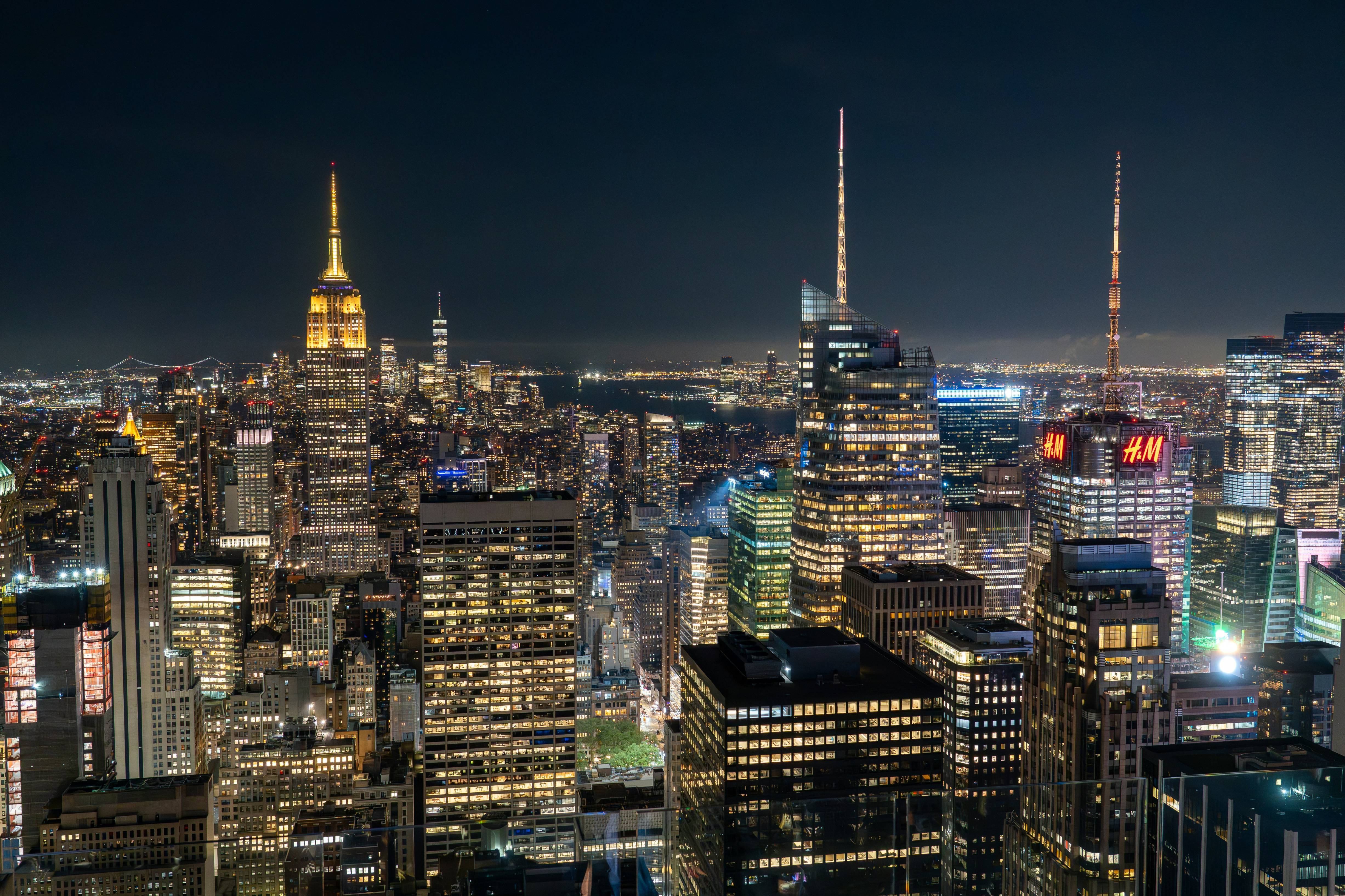 A view of a city at night from the top of a building