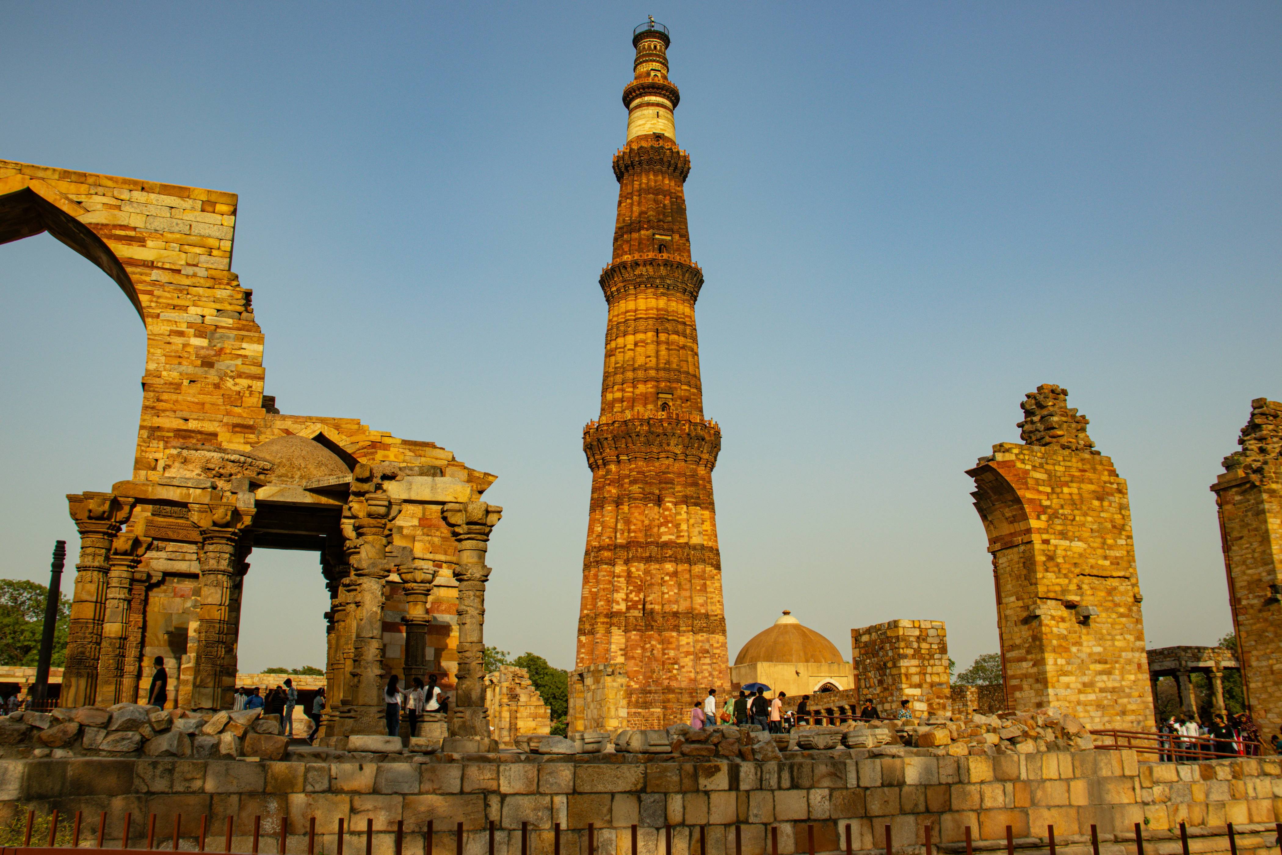 a tall tower in the middle of ruins