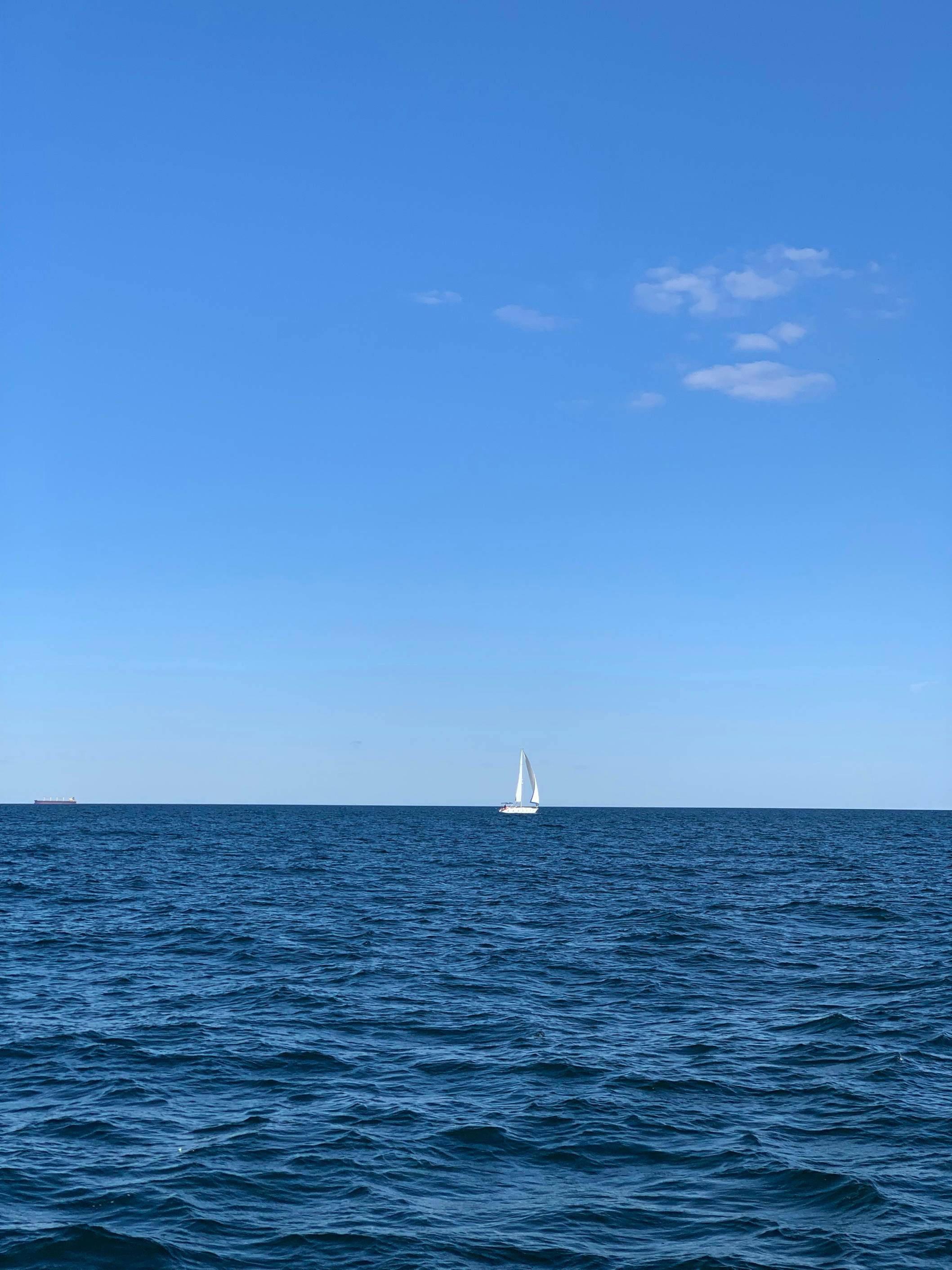 a sailboat in the middle of a large body of water