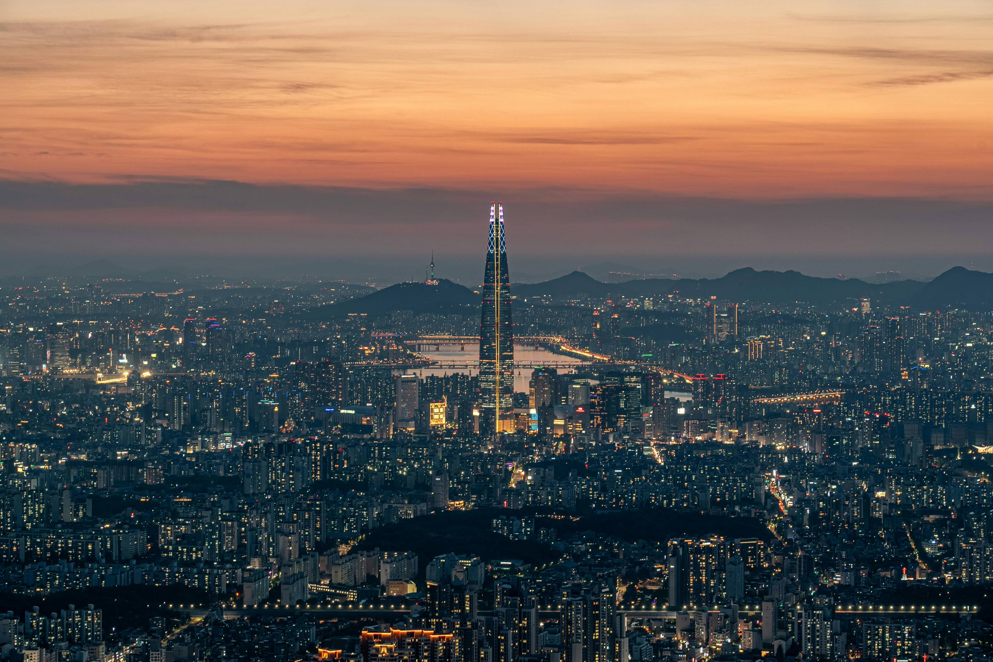 An aerial view of a city at sunset