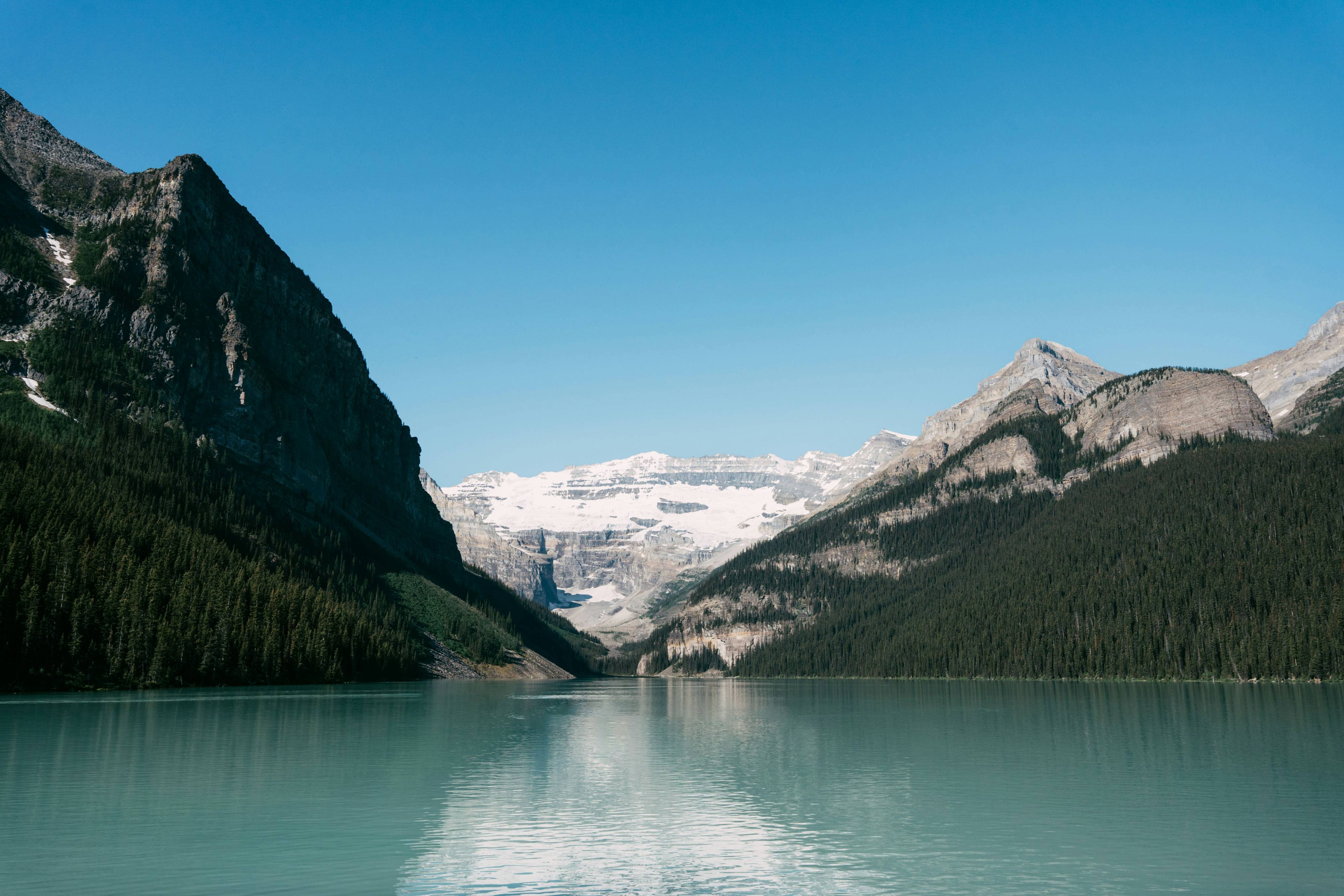a lake with mountains in the background